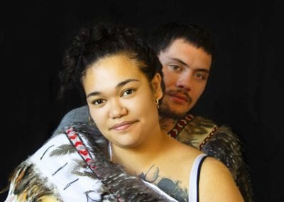 Young Maori couple wearing korowai