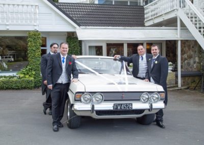 wedding party with Ford car wedding car outdoors at Wallaceville House