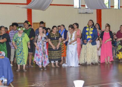 Tokelauan wedding, & groom taking part in traditional group dance