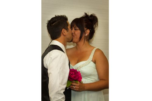 Closeup of first kiss for bride & groom at Wellington registry office