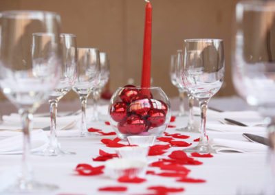 wedding reception and christmas table decorations, red petals, candles & hearts