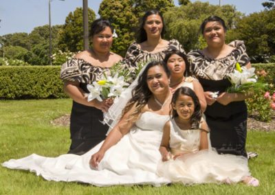 Samoan bride, daughters & ladies in sunny windy rose garden