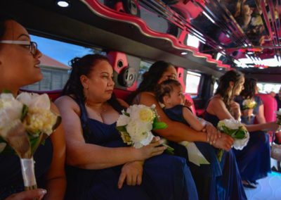 Maori bride & bridesmaids in colourful stretch limo