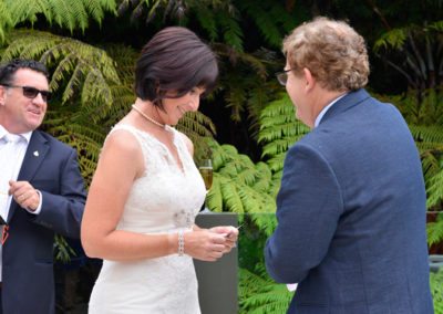 bride & groom with bride reading vows in native bush setting