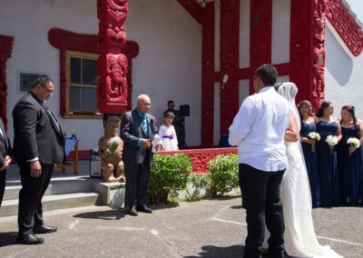 Maori wedding Waiwhetu marae, bride & son approach elder & groom