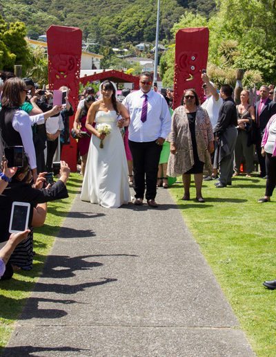 Waiwhetu marae, Maori bride & son walking down path to wedding