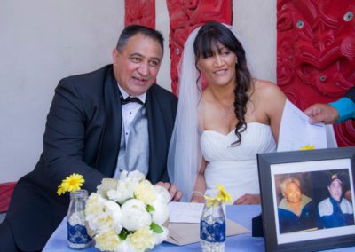 Maori bride & groom signing register Maori wedding Waiwhetu marae