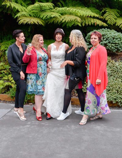 bride & lady friends lined up showing off their shoes