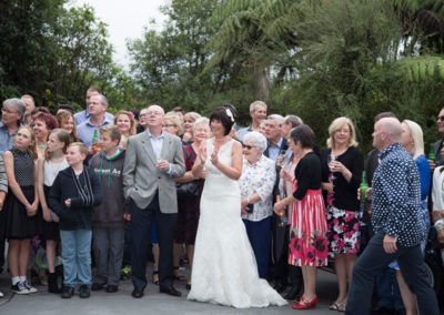 happy wedding group photo outdoors in native bush setting