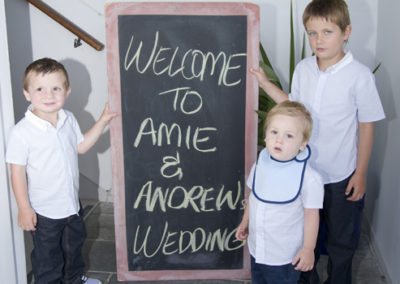 welcome to wedding sign with bride & groom's sons