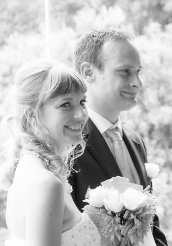 B&W romantic smiling bride & groom closeup