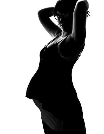 pregnancy maternity black & white profile pregnant woman with arms up