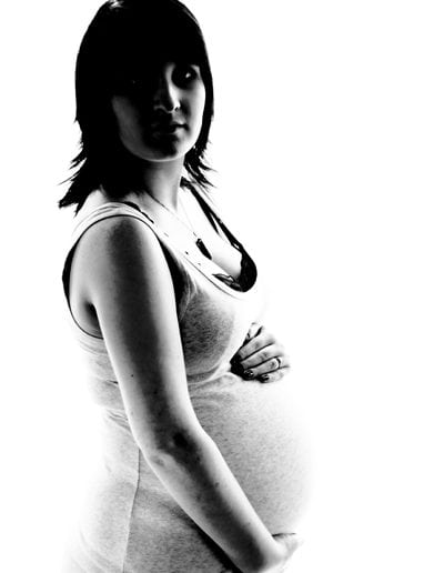 pregnancy maternity black & white image of pregnant woman wearing a singlet