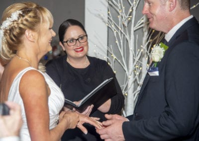 Dowse Art Gallery bride & groom exchanging rings