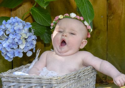 baby girl in cane basket